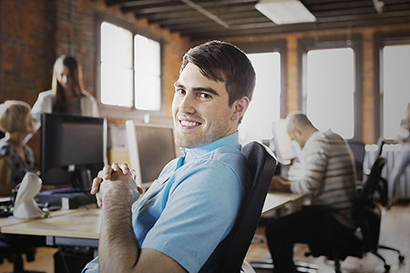 Image of man smiling in the office