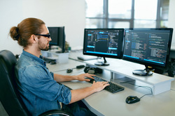 cybersecurity man at keyboard